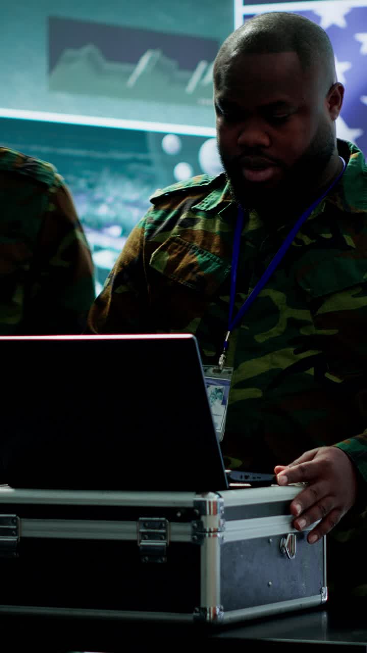 Vertical Video Military officer in a high tech control center engages in cybersecurity operations