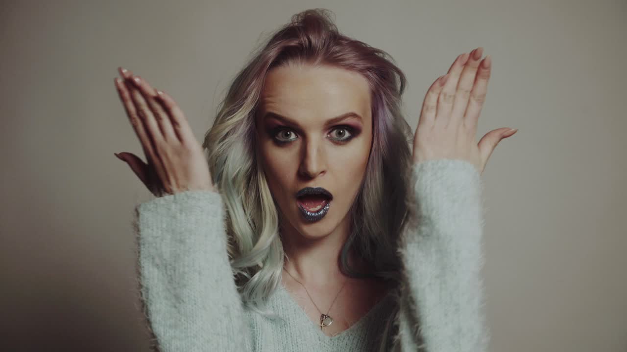 Beauty Portrait. Hairstyle. Portrait of a beautiful girl with colored hair, professional hair coloring