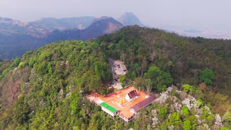 aerial above buddhist temple close to the summit of doi tung, the highest peak of the doi nang non mountain range, chiang rai province