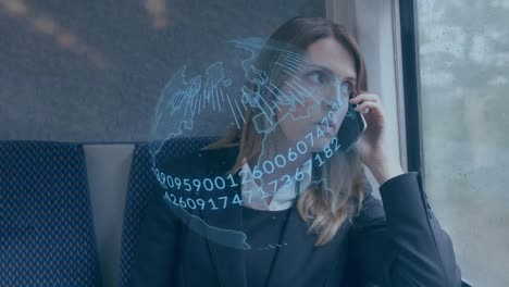 Animation-of-blue-globe-and-data-processing,-over-businesswoman-on-train-talking-on-smartphone