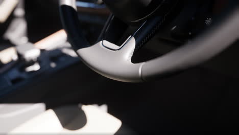 close-up of a car steering wheel and interior