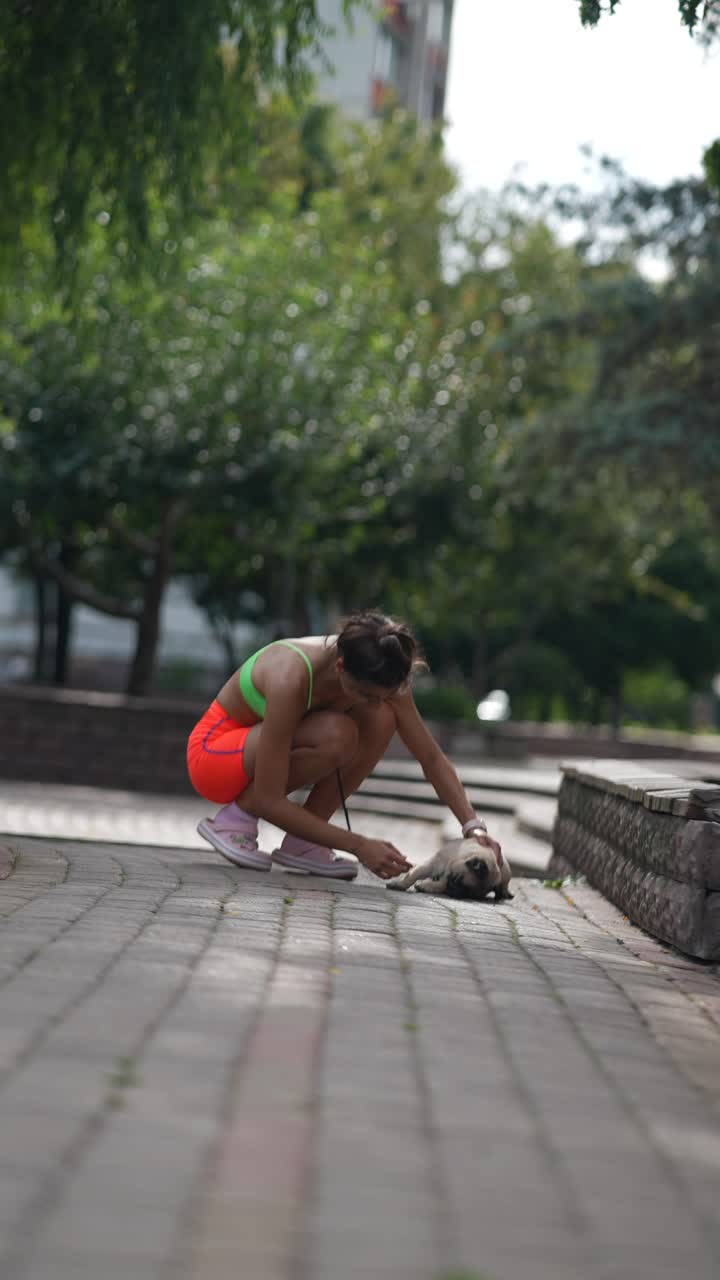 Woman with Pug in a Park