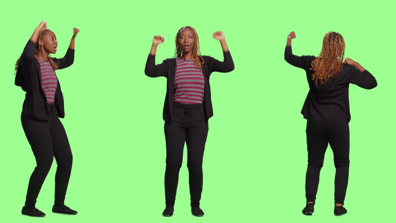 Excited African American Woman Celebrating Success in Studio