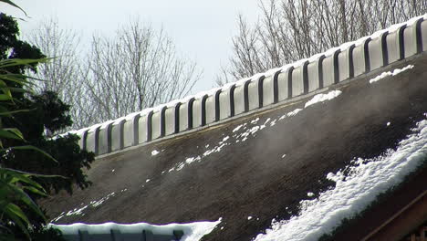 Roof-of-Japanese-house-emits-mist-from-melting-snow