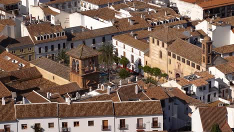 People-gathered-in-square-in-typical-Spanish-town-in-Andalusia---Long-shot