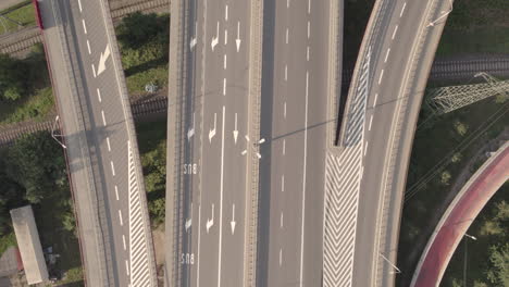 aerial top down on empty modern road junction in a large megapolis, fork in the road in gdynia city