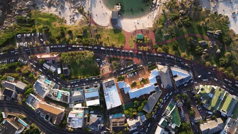 top down aerial view of camps bay (name of cove), rocks, and atlantic ocean