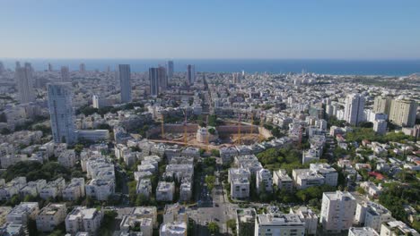 statice-shot-in-front-of-a-big-city-square-impressive-project-construction---beaches-in-the-background