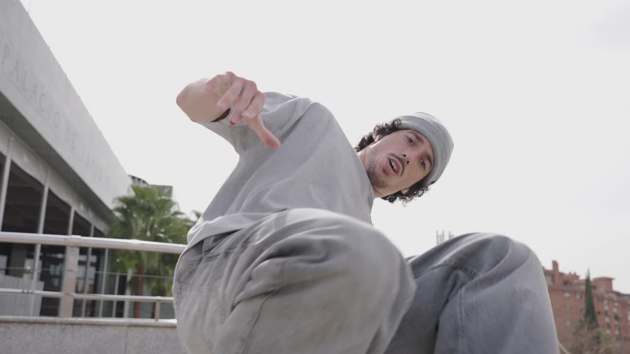 Breakdancer performing energetic moves in urban setting