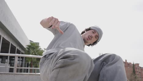 breakdancer performing energetic moves in urban setting