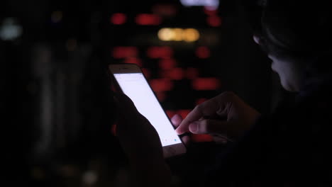 person using a smartphone at night