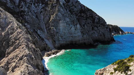 Beautiful-white-rock-mountains-of-Kefalonia-by-the-sea--Aerial