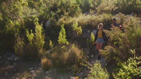 caucasian couple hiking in nature