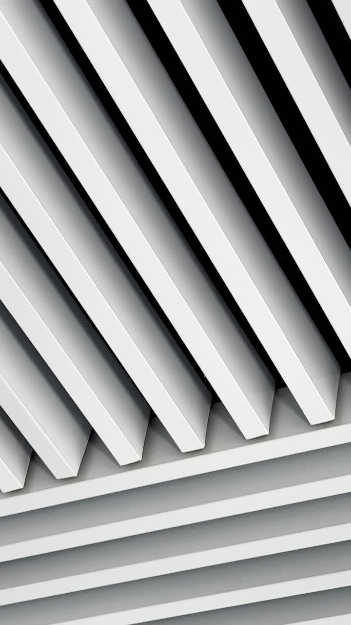 Ceiling decorated with panels in diverse directions and led lamps among them. Black and white image of switched on illumination. Low angle view. Vertical video