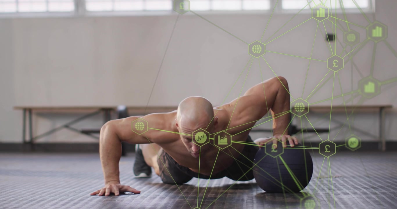 Man i plankposition utför medicinbollsarmhävningar, glider bollen på en texturerad matta, grön-hex-mönster justerar överkroppen, fitness.