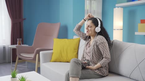 happy young woman listening to music with headphones.