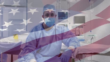 Animation-of-american-flag-over-caucasian-male-doctor-with-face-mask