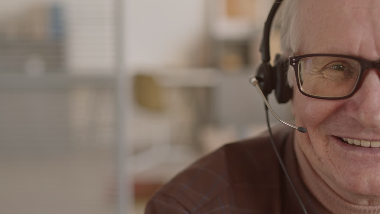 Senior Man with Headset Smiling