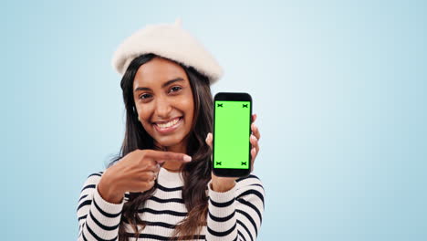 pointing, green screen and woman with cellphone