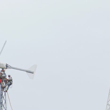 dangerous profession - two men working on a wind turbine 4