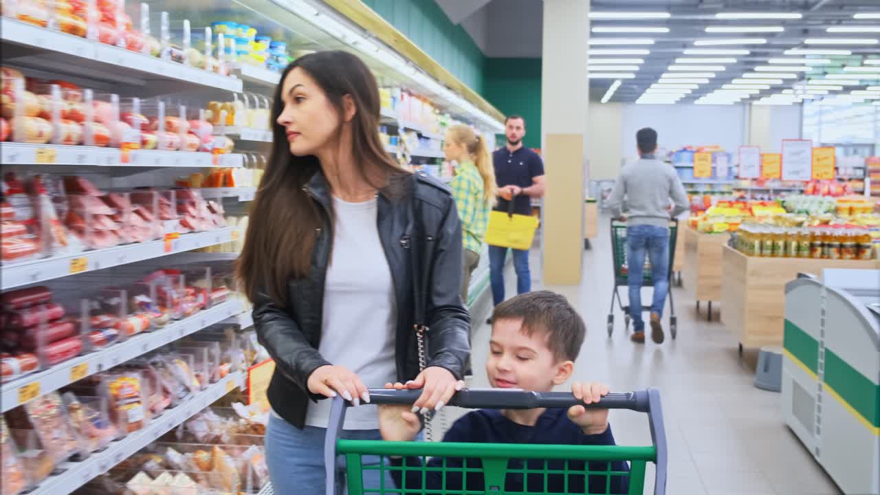 Mother and son shopping at the supermarket