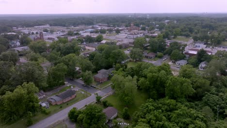 Tuskegee,-Alabama-downtown-and-Macon-County,-Alabama-courthouse-with-drone-video-moving-in-at-an-angle