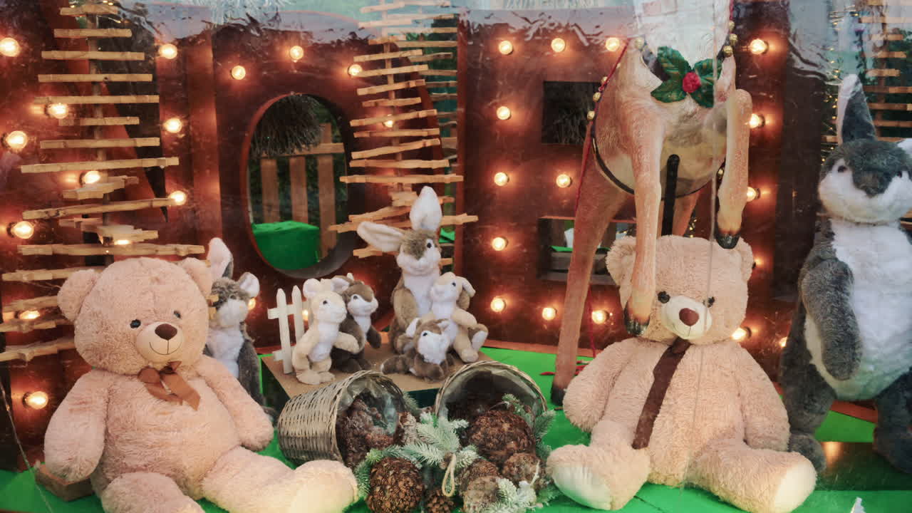 A festive shop window display featuring plush toys and Christmas decorations