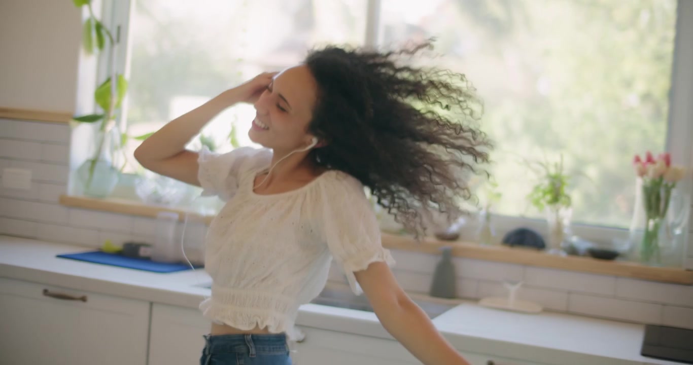 Carefree woman singing and dancing