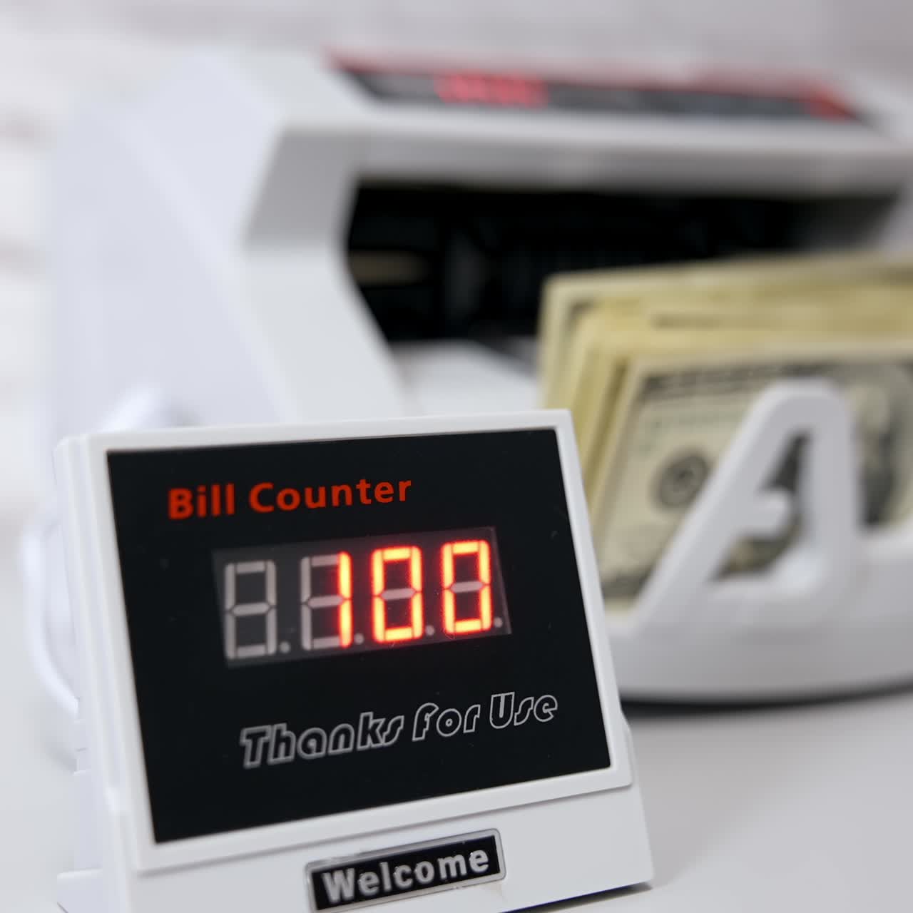 Electronic device showing the amount of money. Equipment for counting money. Money are counted in a calculating machine. Automatic equipment for banking financial transactions