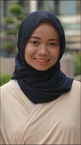 portrait of a smiling woman in hijab