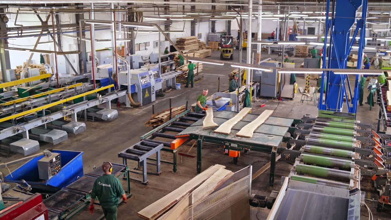 Wooden boards after sawing at the sawmill. Logging industry. Special technik closeup. Wood based industry department.