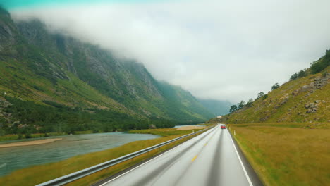 go along the scenic road among the mountains of norway first-person view