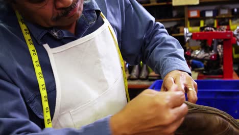 Cobbler-repairing-a-shoe