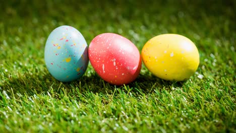 Animation-of-colourful-easter-eggs-on-grass