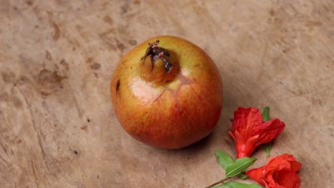 ripe pomegranate fruit on wooden vintage background