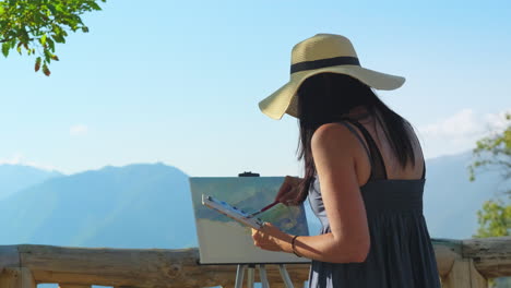 artista pintando un paisaje de montaña