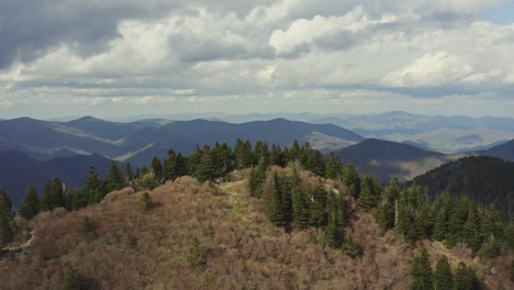 Drone-passing-over-peak-in-Blue-Ridge-Mountains-to-reveal-scenic-valley-below