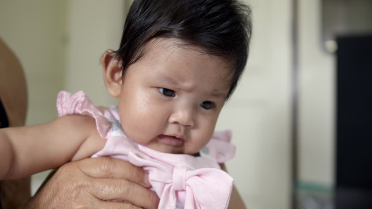 Adorable Baby Girl in Pink Dress