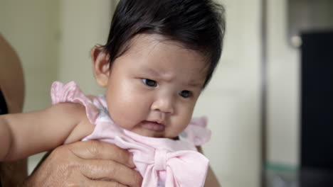 adorable baby girl in pink dress