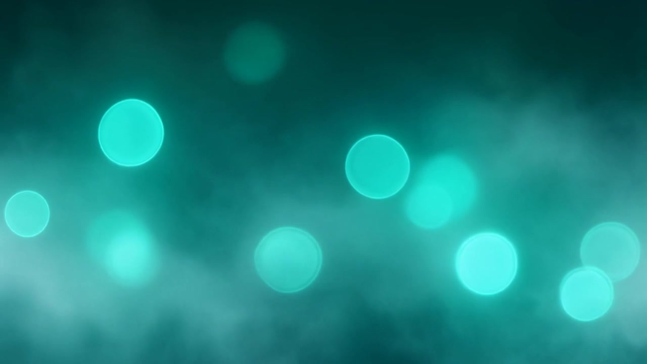 Abstract Teal Bokeh Lights Floating in Foggy Atmosphere