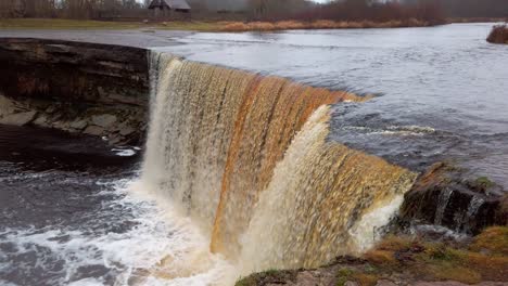 estonia, beautiful jägala waterfall from top view on a cloudy and early wintery day