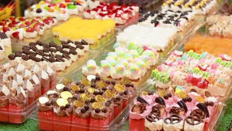 vibrant desserts displayed at bangkok's floating market