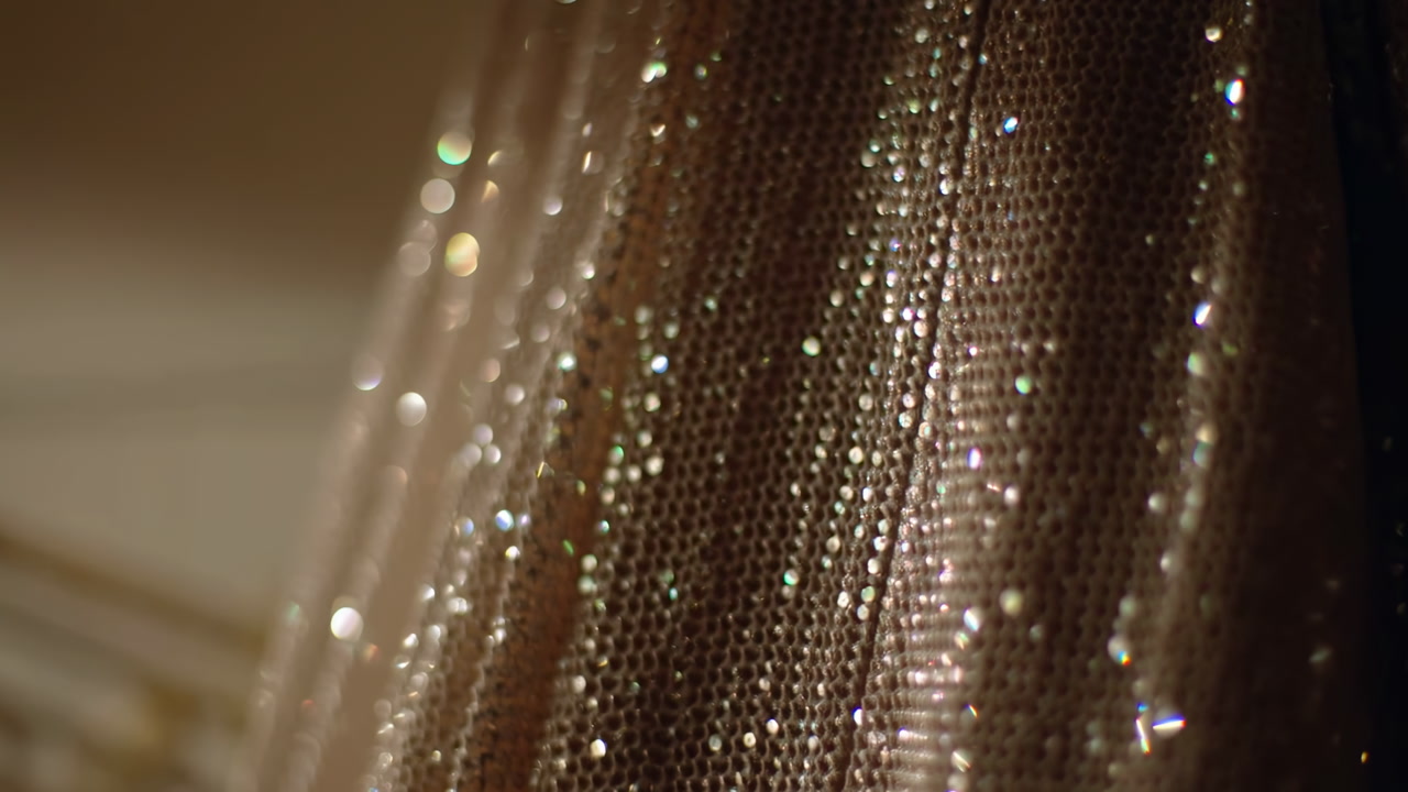 Shimmering Sequined Fabric Draped Closeup, Warm Golden Bokeh Highlights, Delicate Mesh And Satin Threads