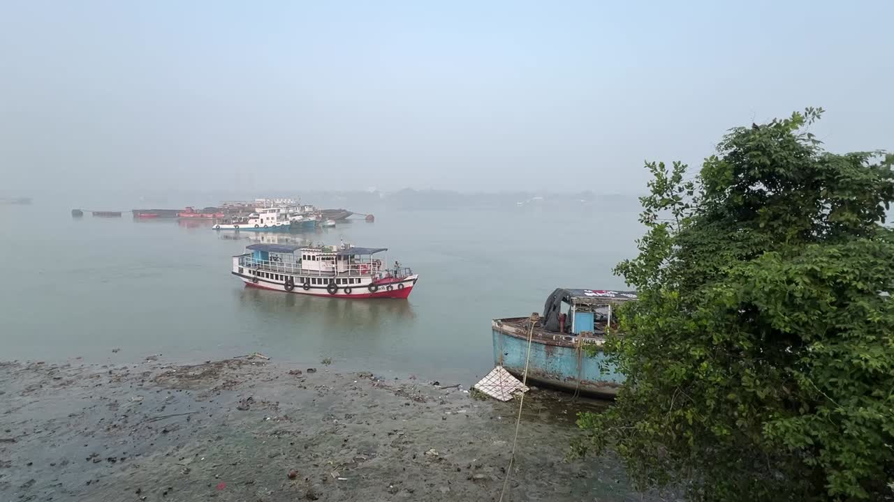 Profile view of a ferry boat sailing on Ganga river during daytime in Kolkata, India