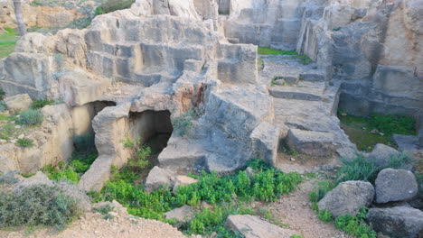 a detailed view of the rock formations and tomb entrances at the tombs of the kings