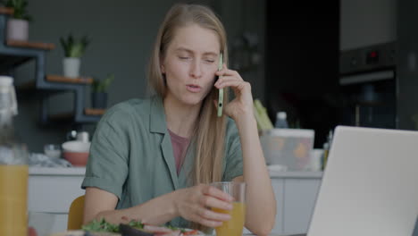 woman working from home during breakfast