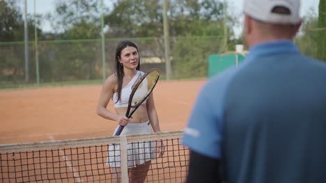 beautiful tennis girl practicing serve on outdoor court