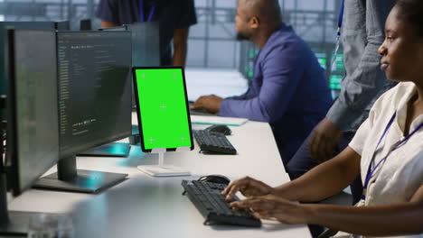 diverse team of tech professionals working on computers