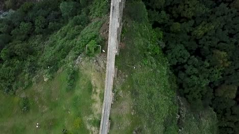 drone shot following the path of the water of the viceregal aqueduct rotating with a perspective of "arcos del sitio" in tepotzotlan, state of mexico, mexico