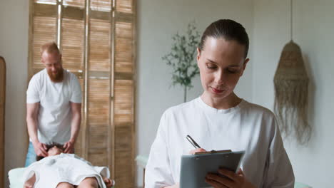 woman posing with clipboard